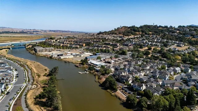 an aerial view of a house with a lake view