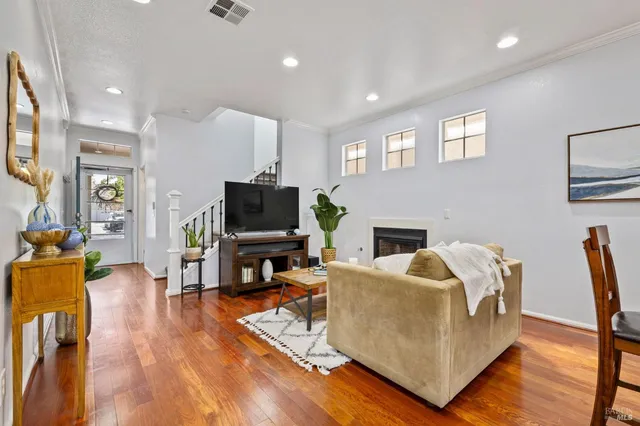 a living room with furniture fireplace and a flat screen tv