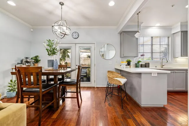 a view of a dining room with furniture window and wooden floor