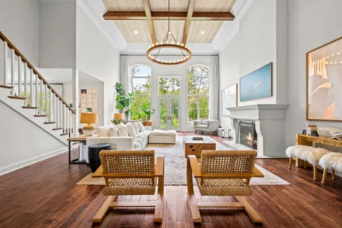 a large kitchen with a large window and stainless steel appliances