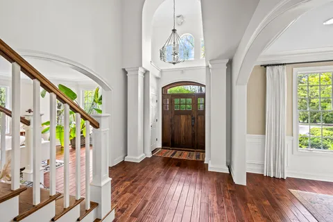 a living room with fireplace furniture and a wooden floor