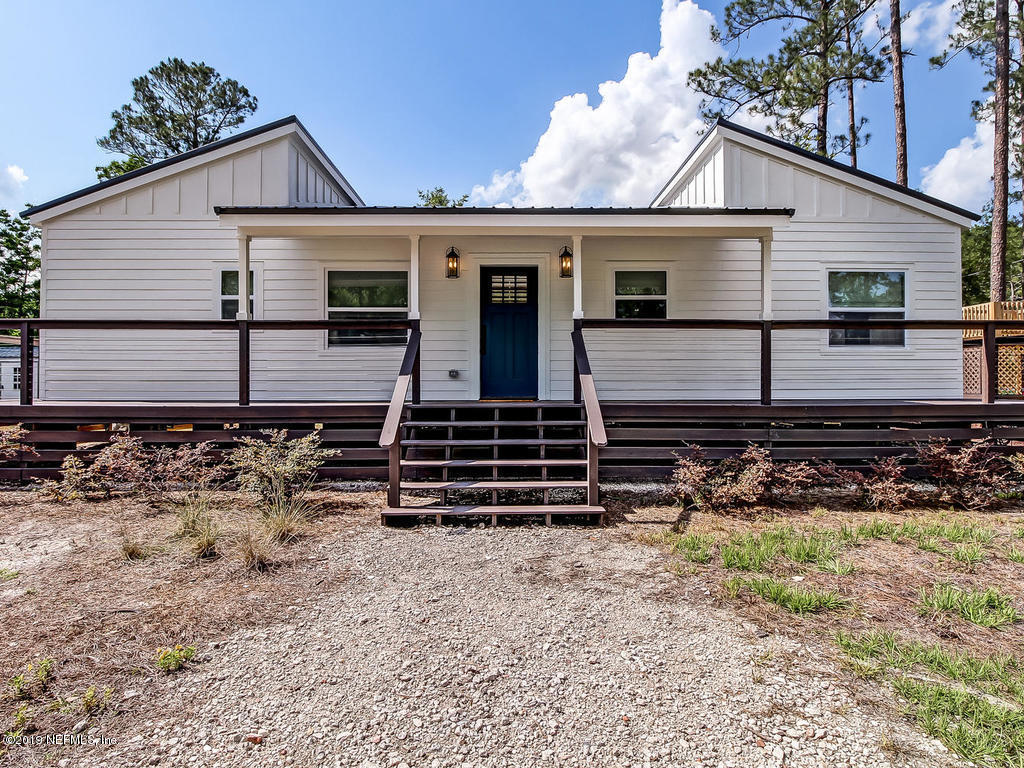 54058 Lawhon Road South Callahan, FL 32011 - Photo 1 of 55 front view of a house with a yard