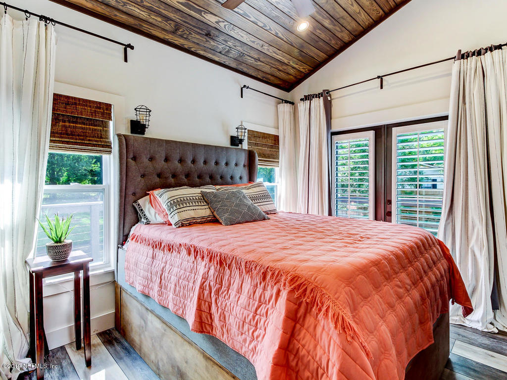 54058 Lawhon Road South Callahan, FL 32011 - Photo 19 of 55 a bed sitting in a bedroom next to a window