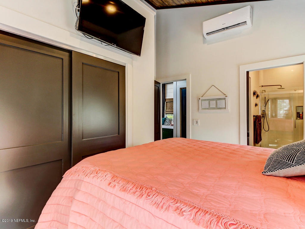 54058 Lawhon Road South Callahan, FL 32011 - Photo 20 of 55 a large bed in a bedroom next to a window