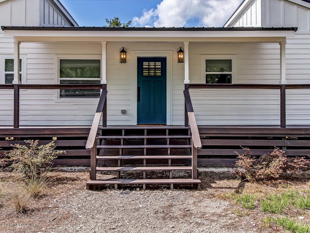 54058 Lawhon Road South Callahan, FL 32011 - Photo 3 of 55 a front view of a house with a yard