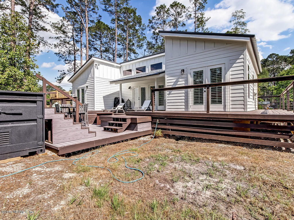 54058 Lawhon Road South Callahan, FL 32011 - Photo 46 of 55 a view of a house with a bed and chairs