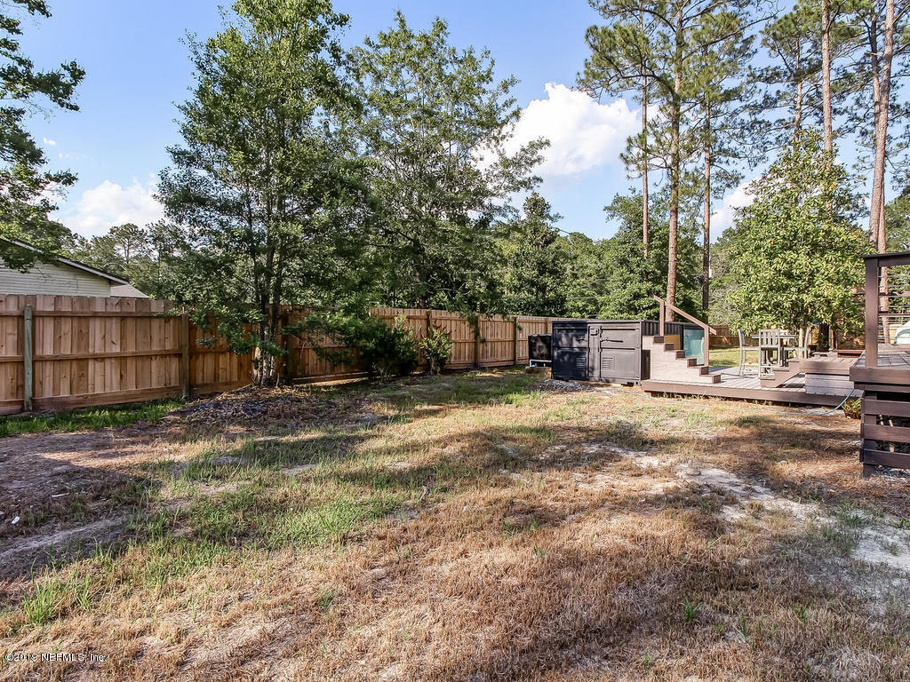 54058 Lawhon Road South Callahan, FL 32011 - Photo 50 of 55 a view of a backyard with large trees