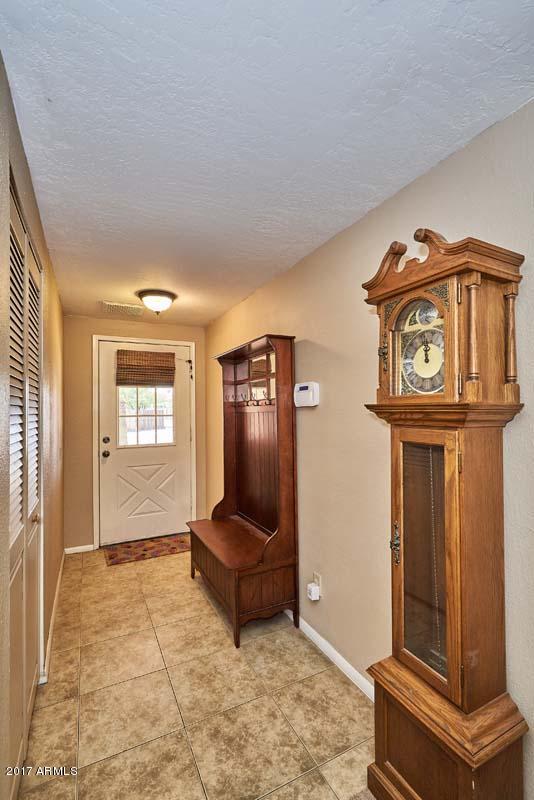 1722 West Colt Road Chandler, AZ 85224 - Photo 3 of 29 a view of a livingroom with wooden floor and furniture