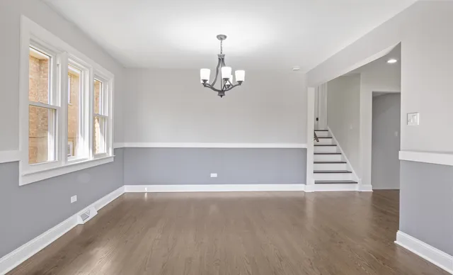 a kitchen with stainless steel appliances granite countertop a refrigerator sink and cabinets
