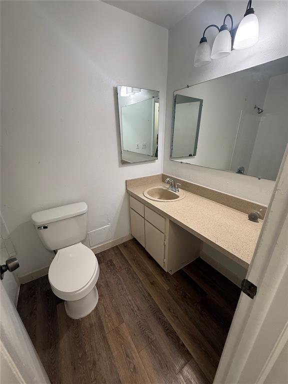 7667 Abonado Road, Unit 7667 Tampa, FL 33615 - Photo 12 of 15 a bathroom with a toilet a sink and mirror