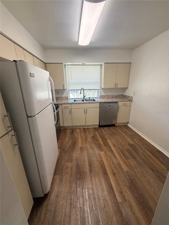 7667 Abonado Road, Unit 7667 Tampa, FL 33615 - Photo 3 of 15 a room with wooden floors and white walls