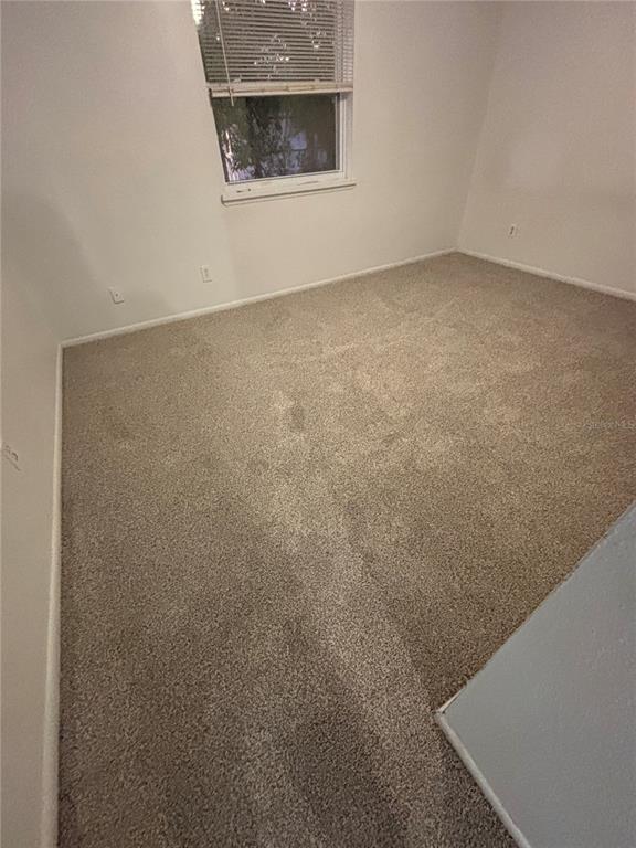 7667 Abonado Road, Unit 7667 Tampa, FL 33615 - Photo 9 of 15 a view of an empty room with a window