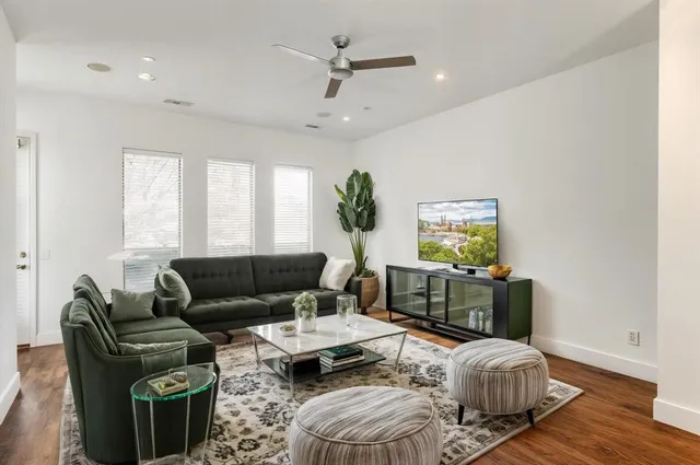 a living room with furniture rug and window