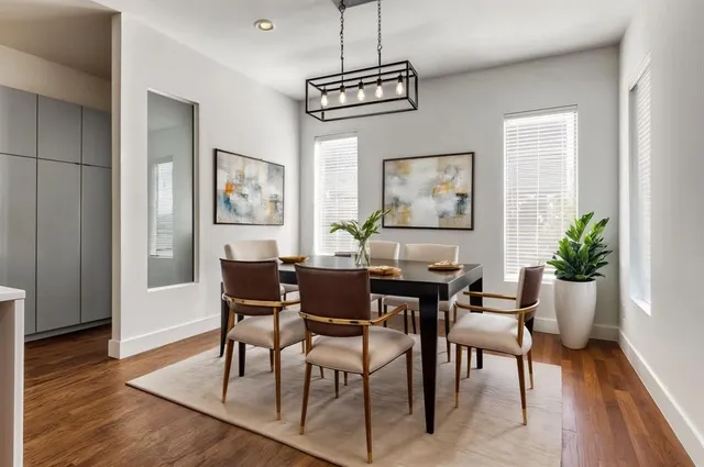 a view of a dining room with furniture window and wooden floor