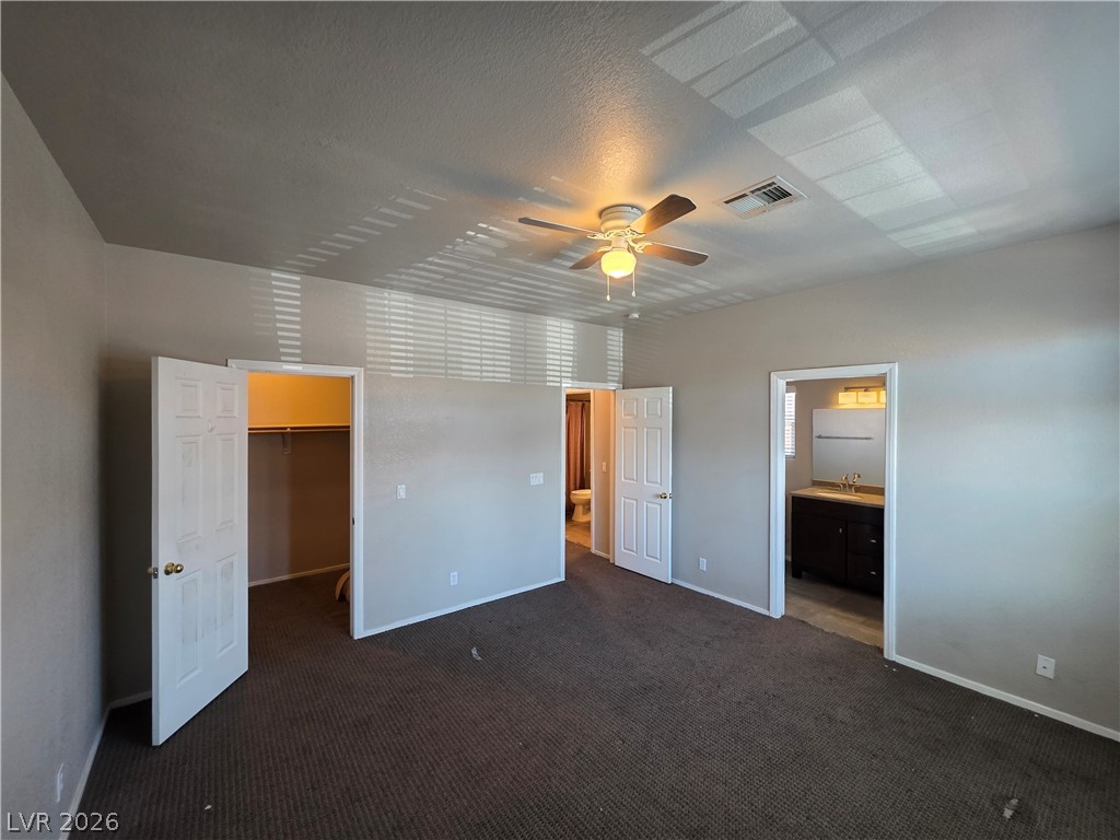 2275 Ramsgate Drive Henderson, NV 89074 - Photo 49 of 84 A comfortable primary bedroom offering an attached bath and a private walk-in closet.