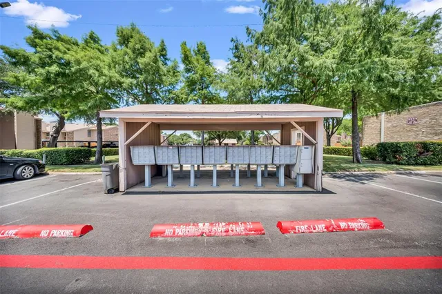 a view of a porch with furniture and garden