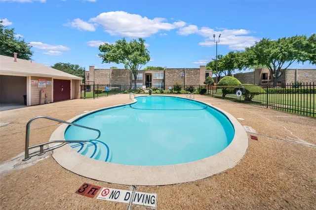 a view of a swimming pool with a patio
