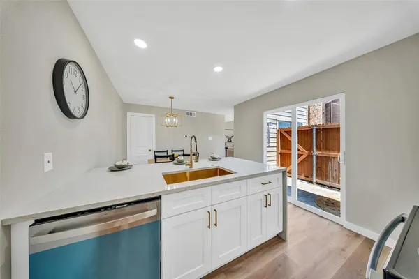 a kitchen with a sink and a window