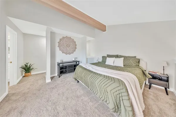 a bedroom with a bed and a table