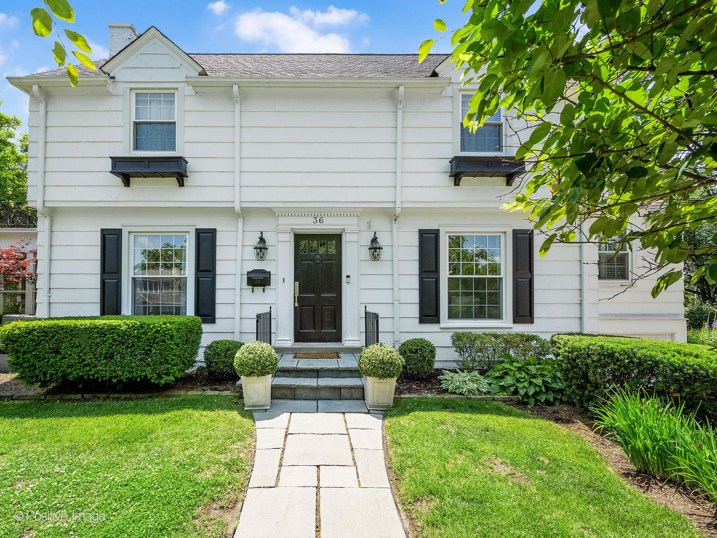 36 Center Street Hinsdale, IL 60521 - Photo 1 of 1 a front view of a house with a yard