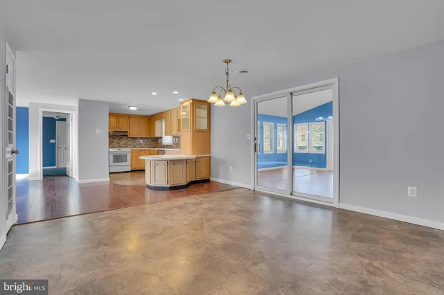a view of a kitchen with a sink and dishwasher kitchen view with wooden floor