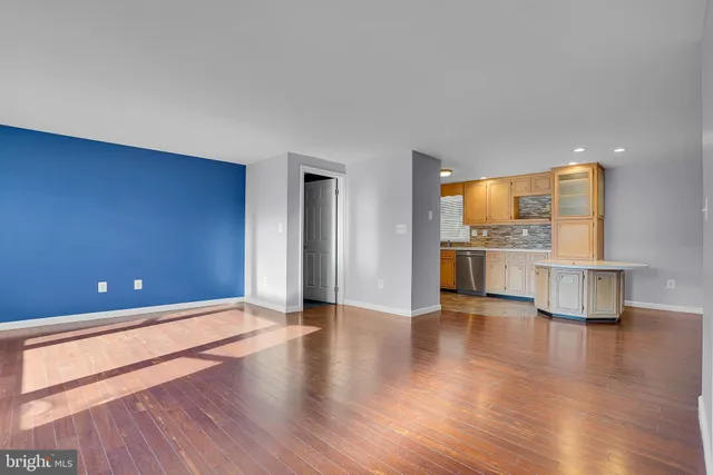 a view of a kitchen with a sink and a stove top oven