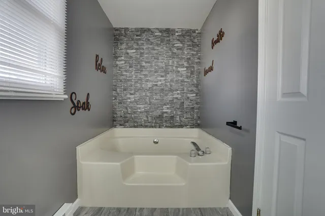 a bathroom with a bathtub