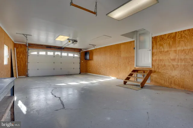 a view of room with projector and windows