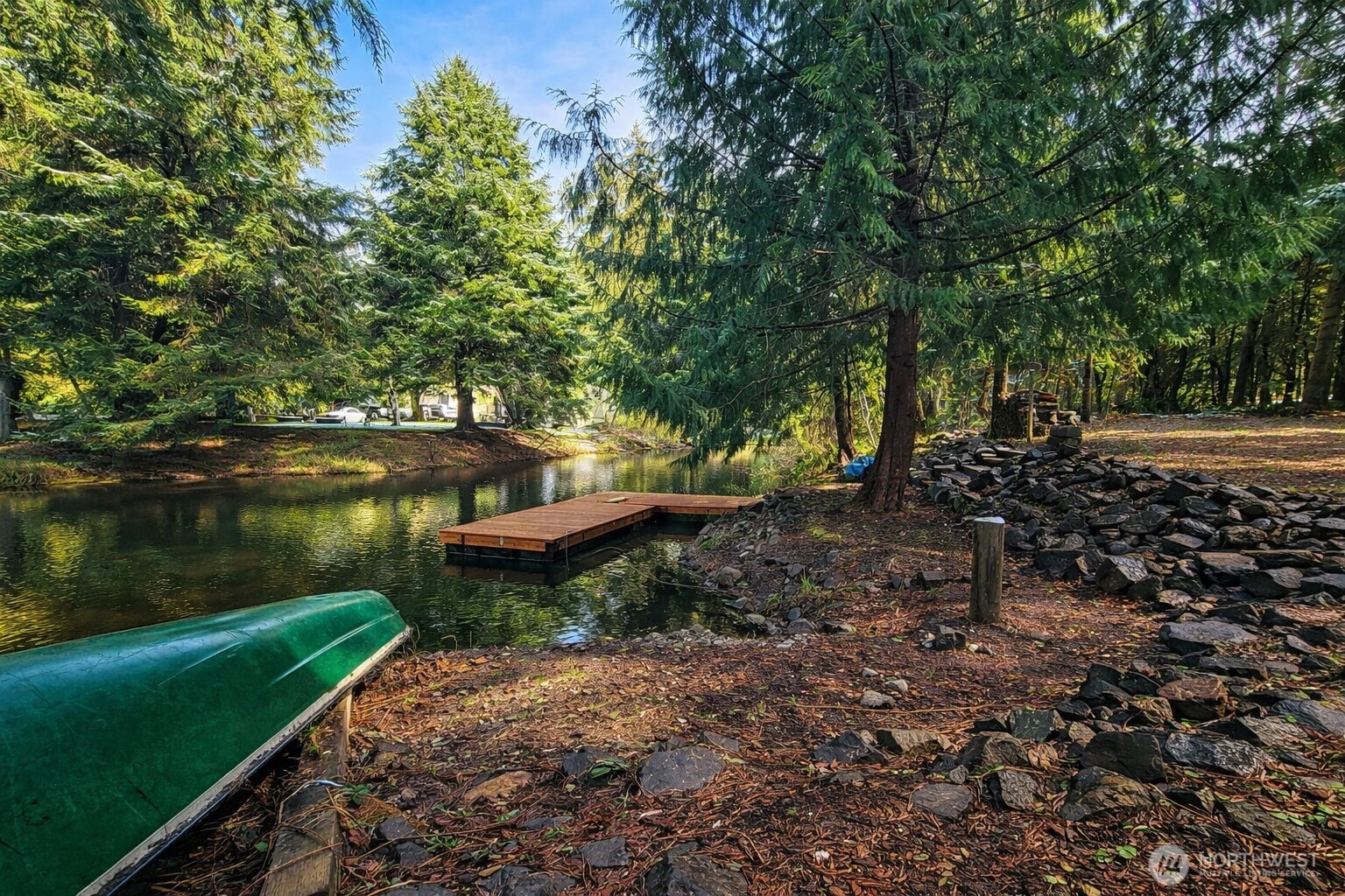 a view of a lake with a house in the background