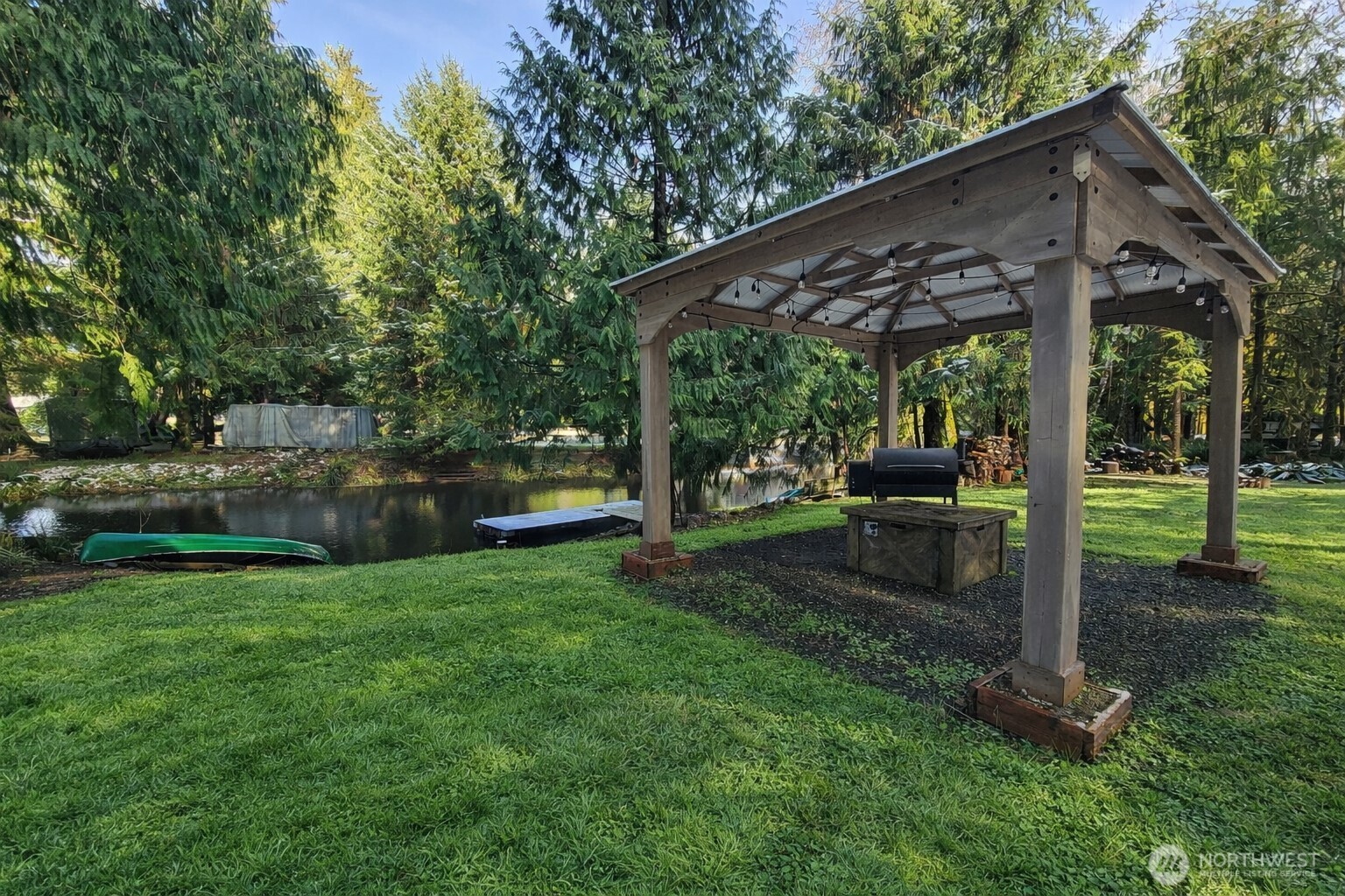 300 Arrowhead Drive Elma, WA 98541 - Photo 3 of 15 a view of a patio with a table chairs and a backyard