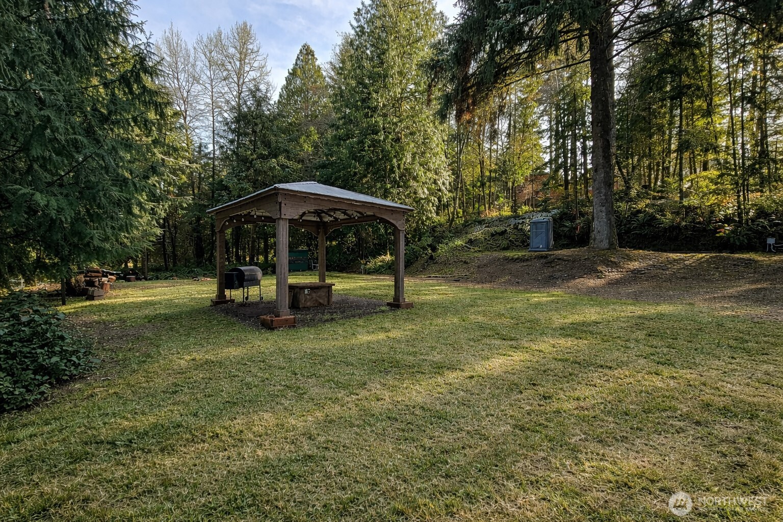 300 Arrowhead Drive Elma, WA 98541 - Photo 8 of 15 a view of a park with large trees and a barn