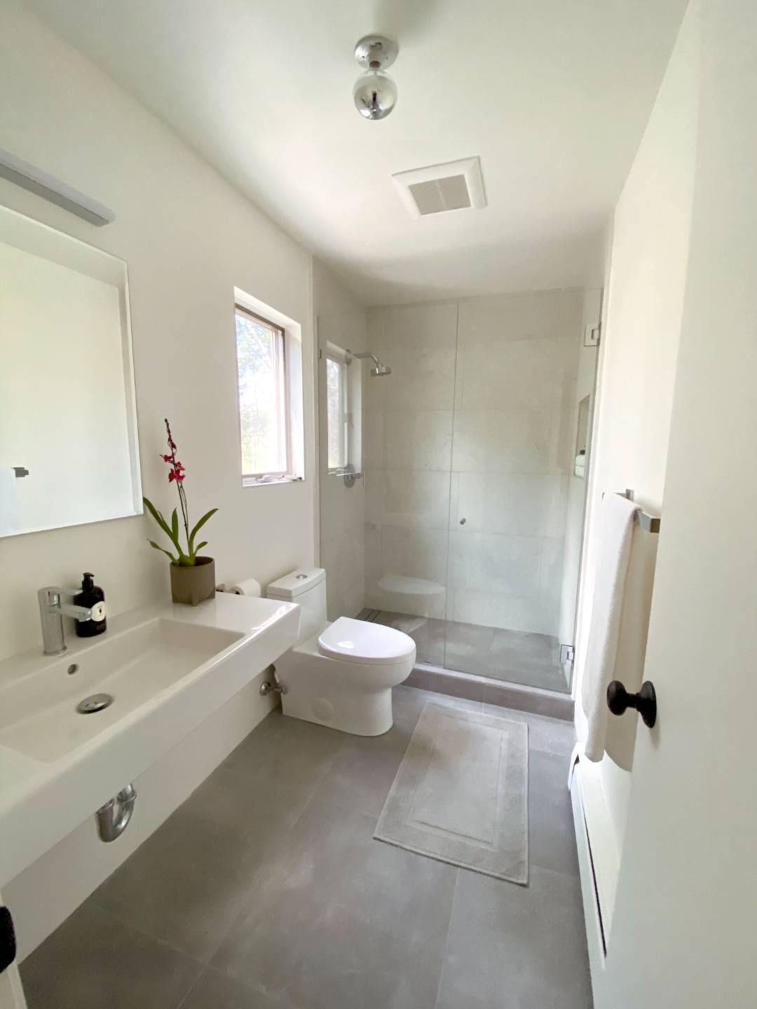 4 Renees Way East Hampton, NY 11937 - Photo 12 of 16 a bathroom with a sink a toilet and shower