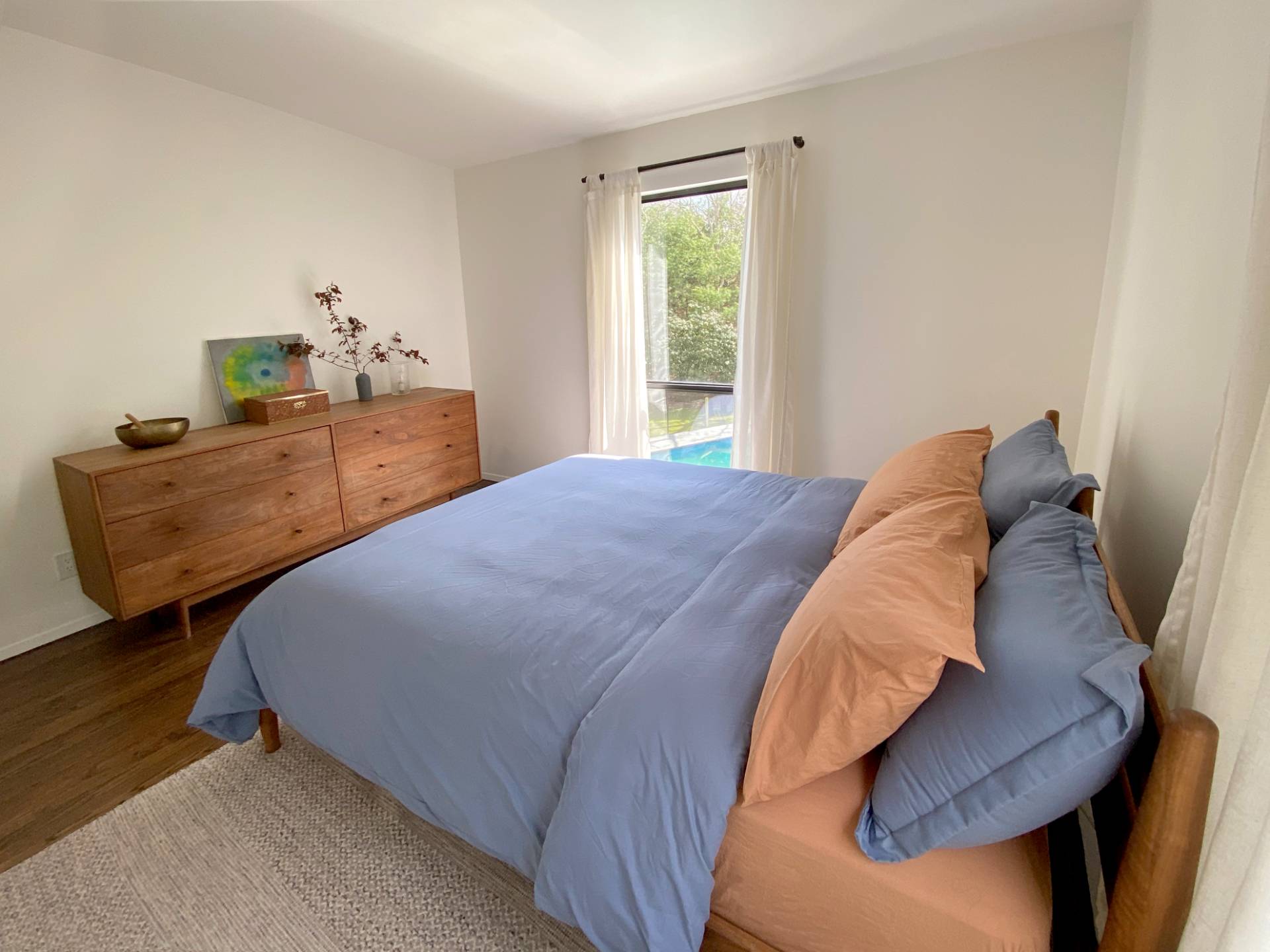 4 Renees Way East Hampton, NY 11937 - Photo 13 of 16 a bed sitting in a bedroom next to a window