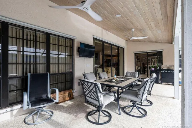 a dining room with furniture and wooden floor