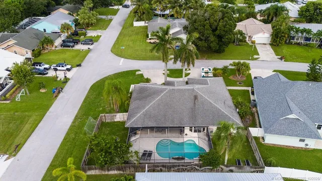 an aerial view of multiple houses with yard