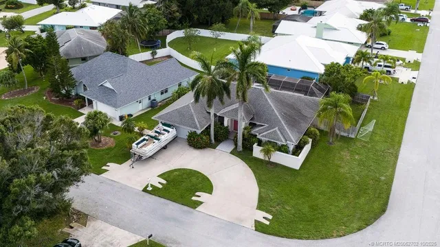 an aerial view of a house with outdoor space