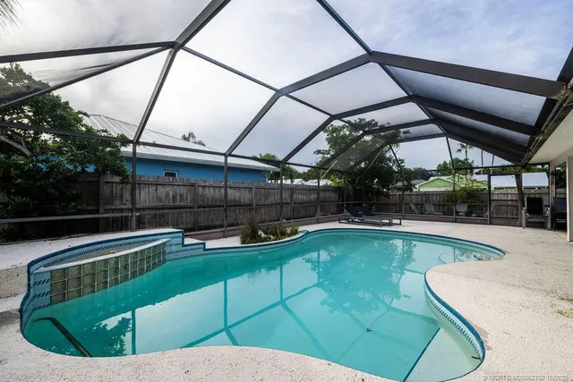 a view of a swimming pool with a patio