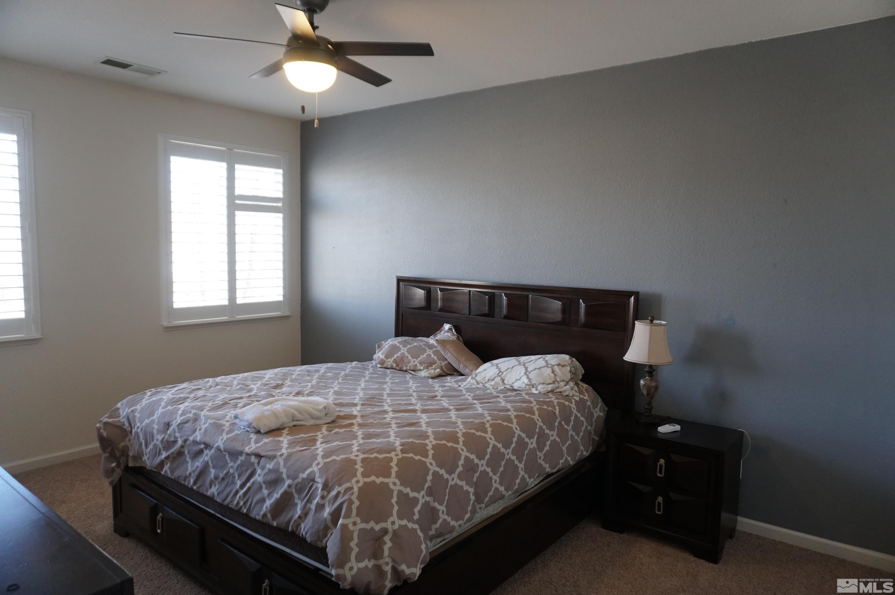2120 Hellaby Lane Reno, NV 89502 - Photo 13 of 21 a bedroom with a bed and window