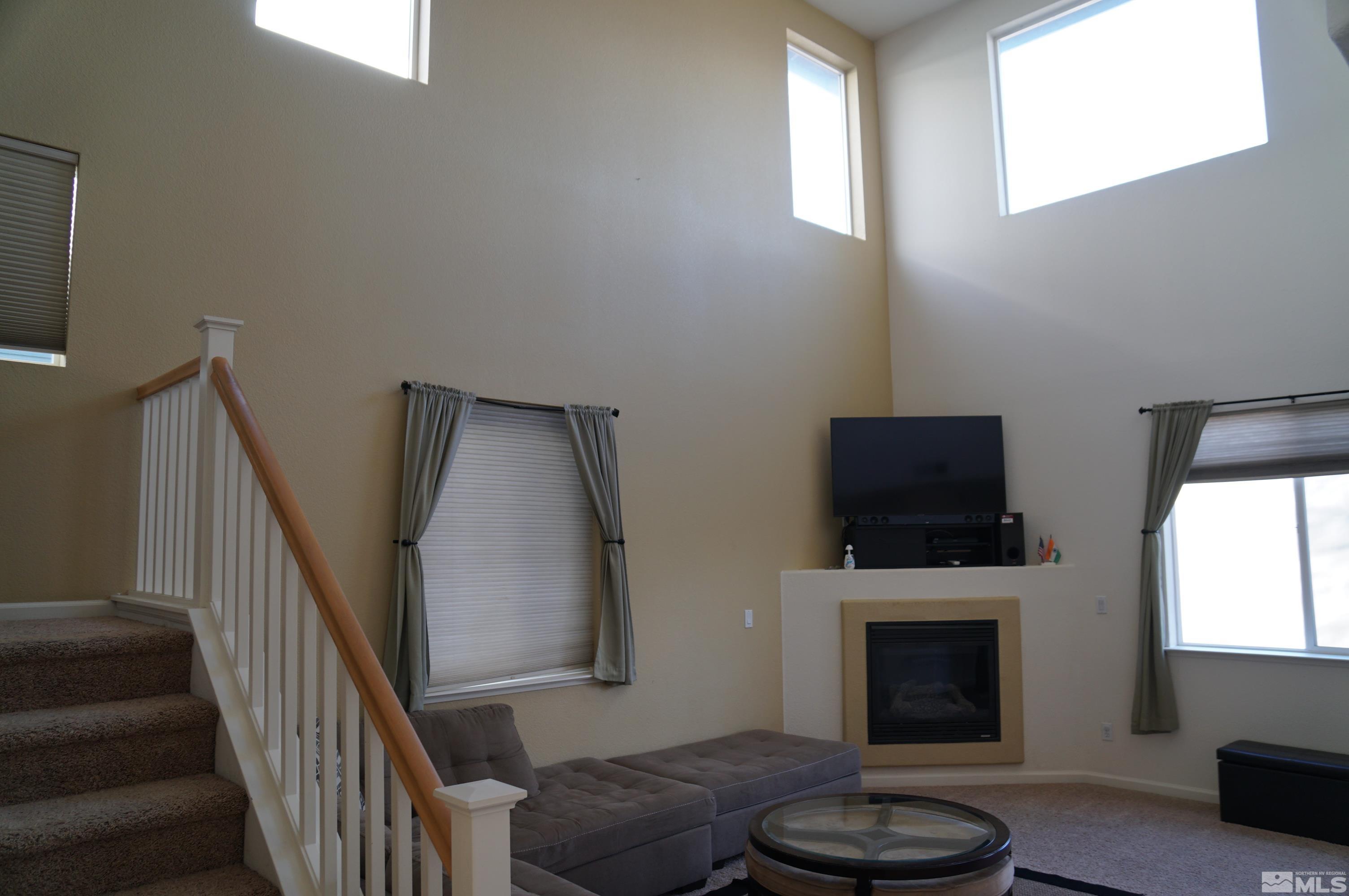 2120 Hellaby Lane Reno, NV 89502 - Photo 15 of 21 a living room with furniture and a fireplace