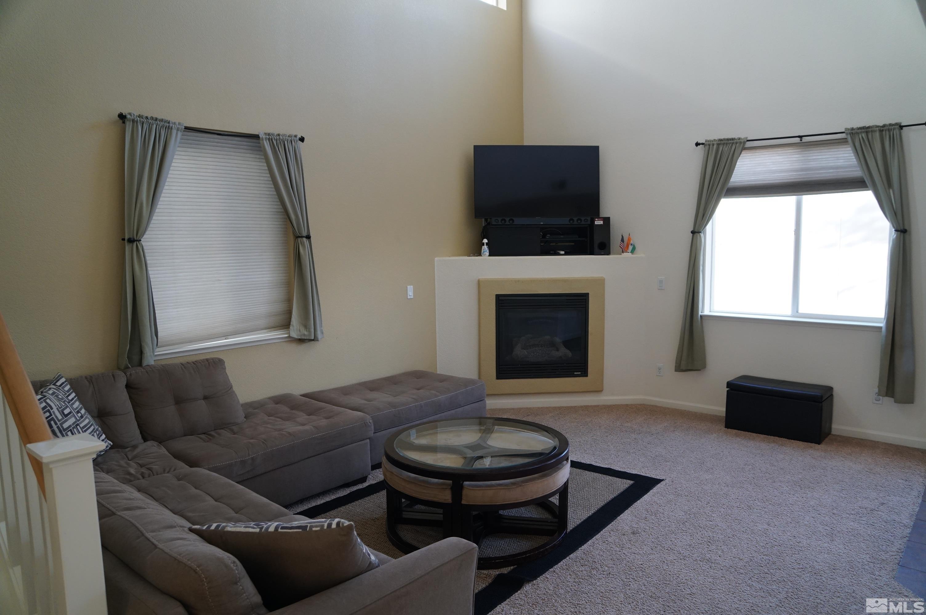 2120 Hellaby Lane Reno, NV 89502 - Photo 17 of 21 a living room with furniture and a fireplace