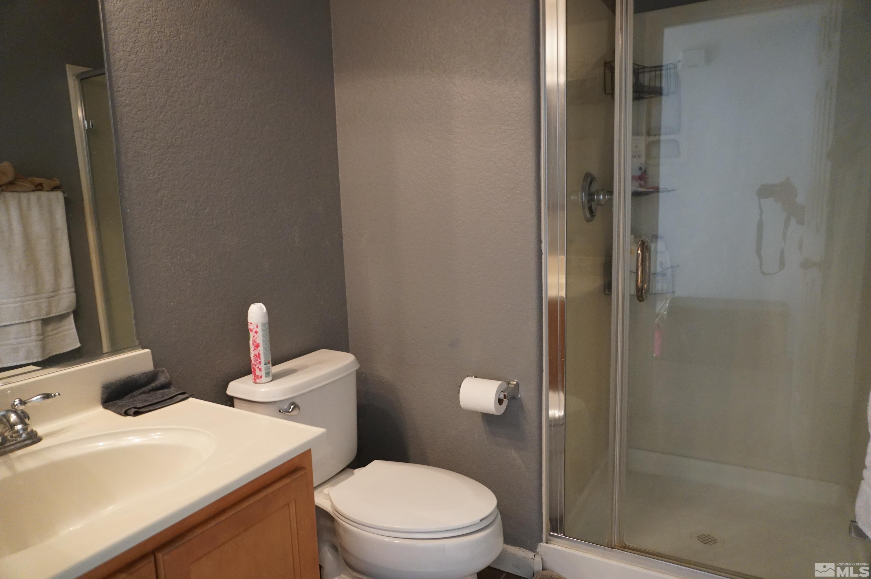 2120 Hellaby Lane Reno, NV 89502 - Photo 7 of 21 a bathroom with a sink a toilet and shower