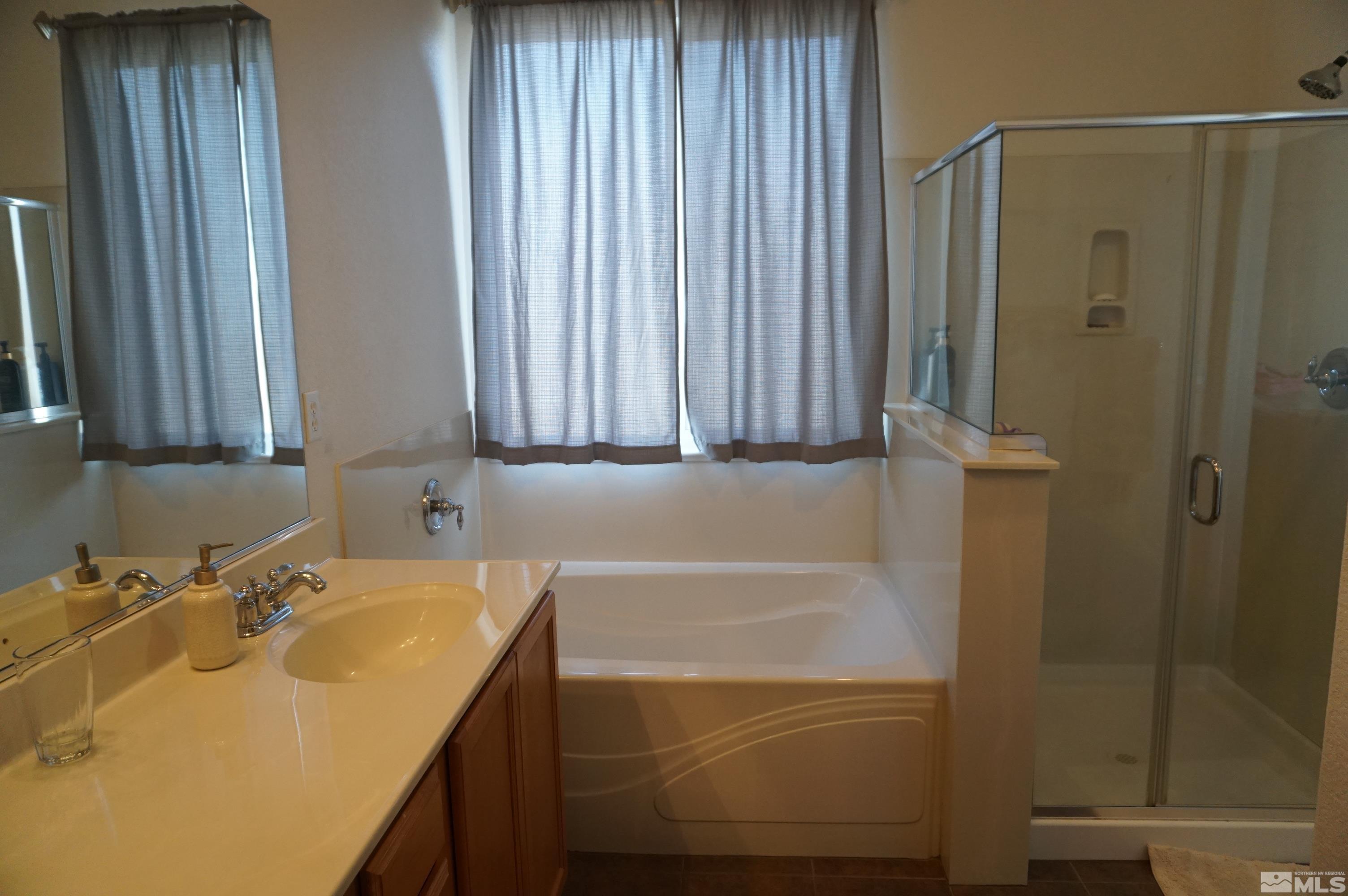 2120 Hellaby Lane Reno, NV 89502 - Photo 8 of 21 a bathroom with a sink and a mirror