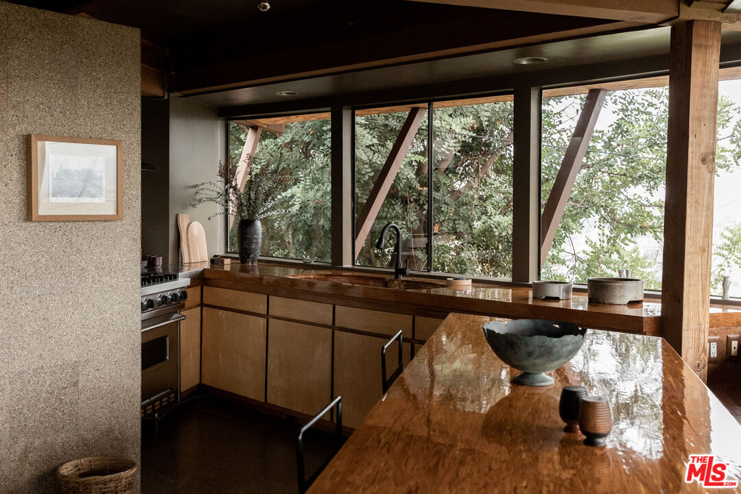 2538 Sundown Drive Los Angeles, CA 90065 - Photo 13 of 27 a living room with furniture and a large window