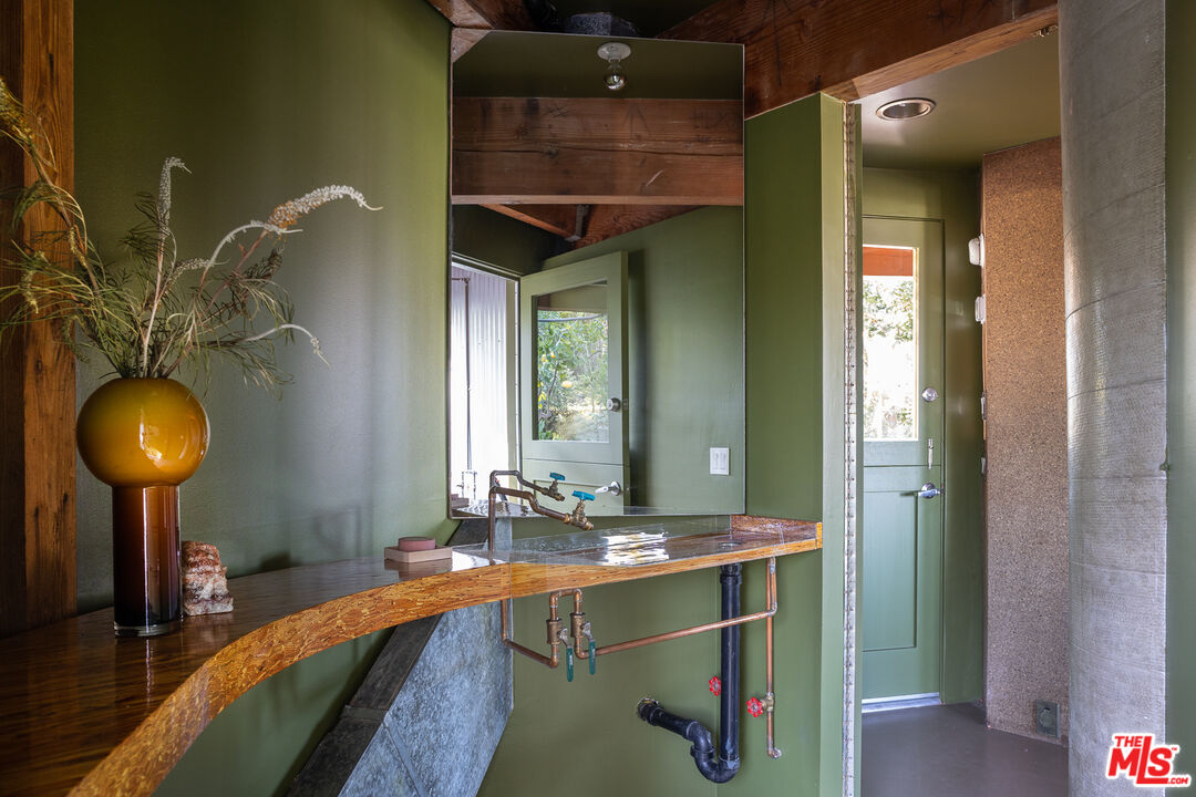 2538 Sundown Drive Los Angeles, CA 90065 - Photo 15 of 27 a bathroom with a sink and a mirror