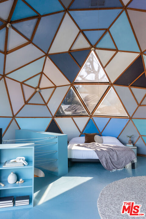 2538 Sundown Drive Los Angeles, CA 90065 - Photo 18 of 27 a bedroom with a bed and a walk in closet