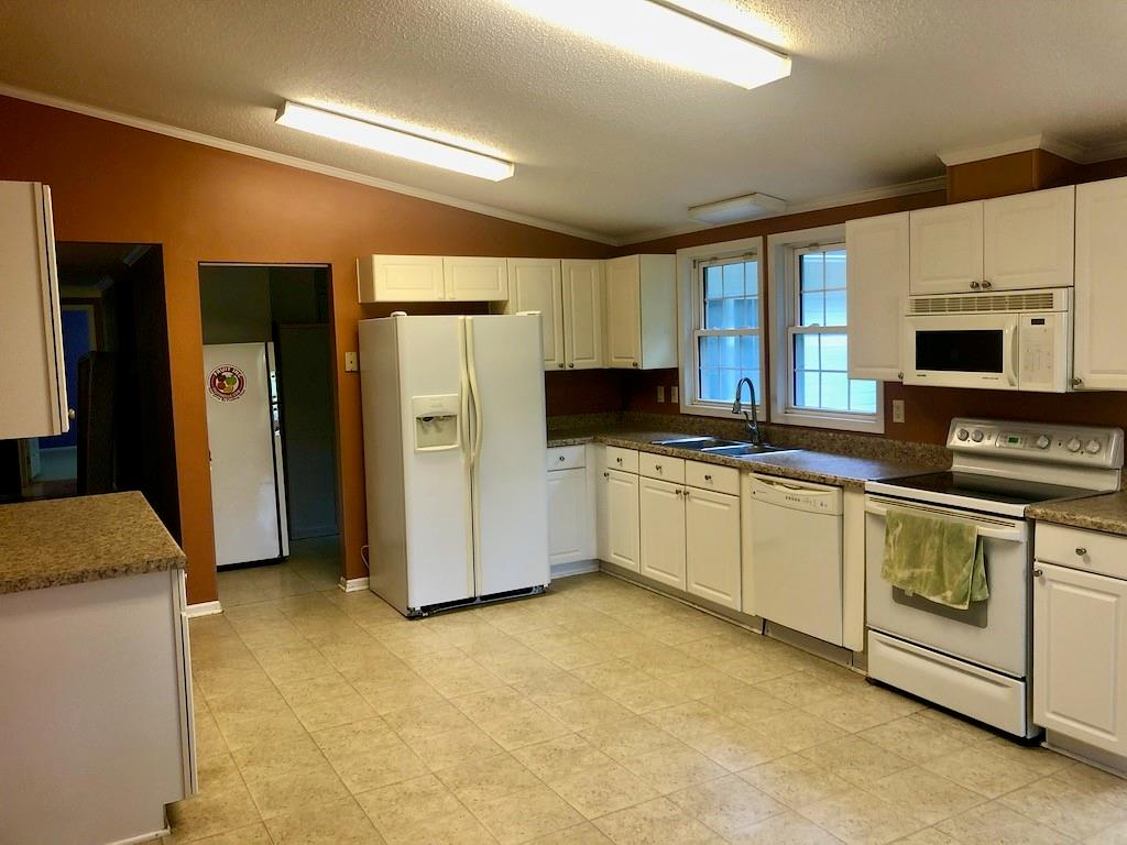 340 Ridge Road Mocksville, NC 27028 - Photo 11 of 22 a kitchen with stainless steel appliances a refrigerator sink and cabinets