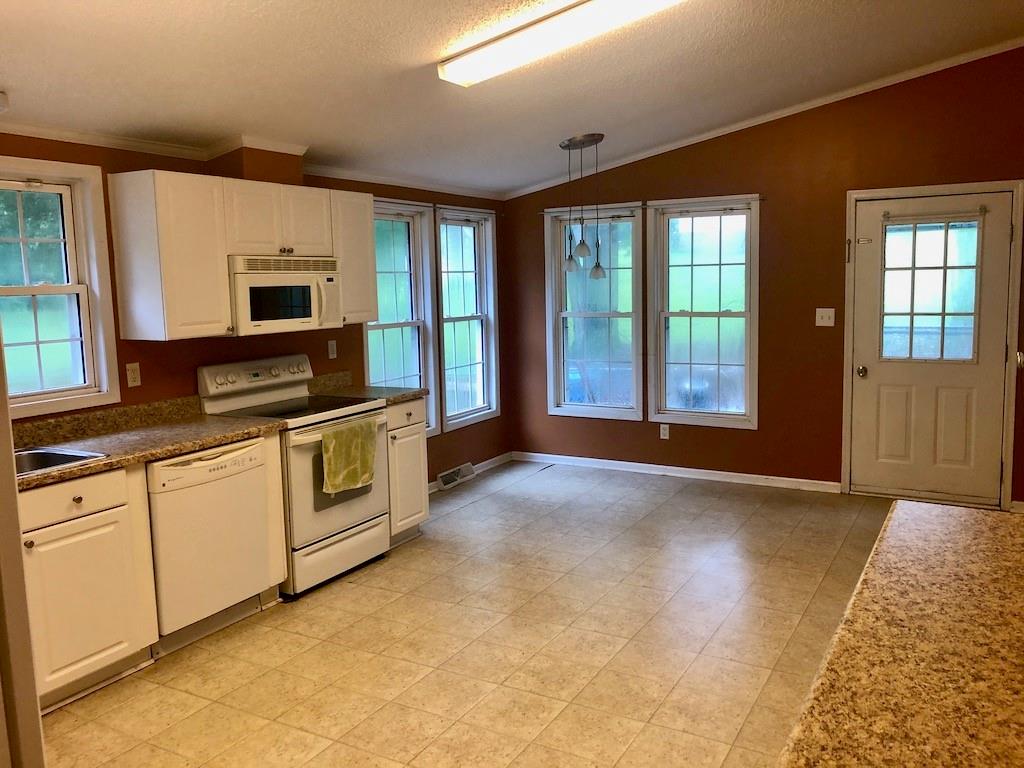 340 Ridge Road Mocksville, NC 27028 - Photo 12 of 22 a view of a kitchen with microwave and windows