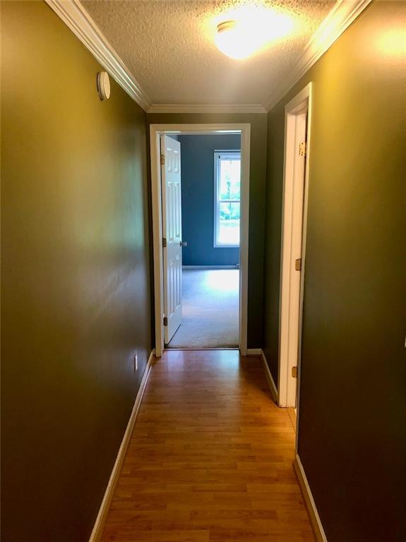 340 Ridge Road Mocksville, NC 27028 - Photo 14 of 22 a view of a hallway with wooden floor