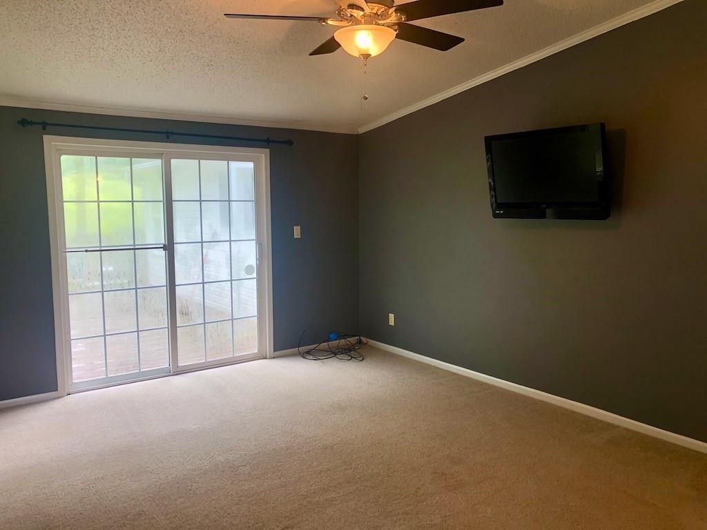 340 Ridge Road Mocksville, NC 27028 - Photo 16 of 22 a view of an empty room with a flat screen tv and a window