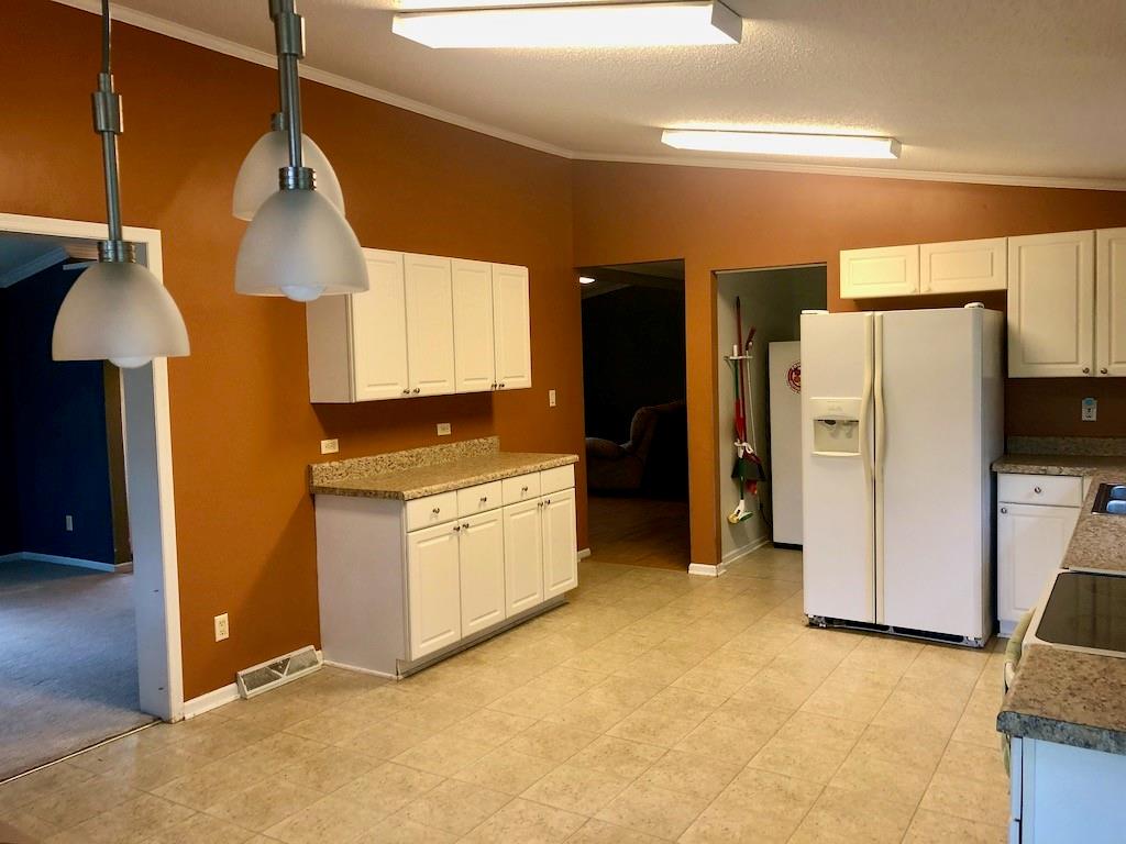 340 Ridge Road Mocksville, NC 27028 - Photo 17 of 22 a kitchen with stainless steel appliances granite countertop a refrigerator a stove and a sink